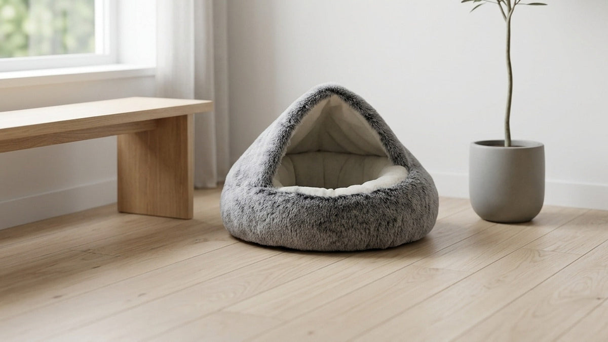 Grey plush cat cave bed in a minimalist Scandinavian-style room for size reference